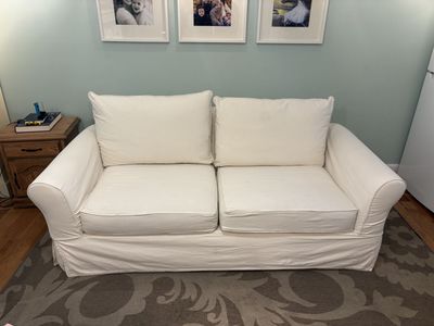 FOR SALE: White Pottery Barn Couch — A Paragon of Purity, Comfort, and Suspiciously Clean Living