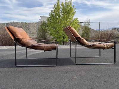 Beautiful genuine leather accent chairs. Down filled cushions. Orig over $1,400 each new Great for Mid Century Modern MCM