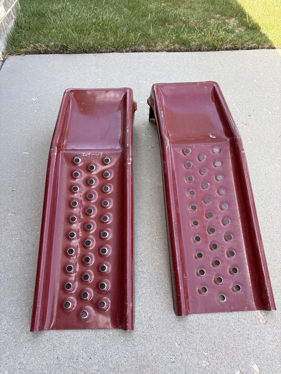 Set of Red Metal Car Ramps used