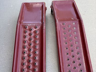 Set of Red Metal Car Ramps used