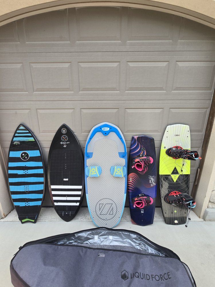 Assorted Wakesurf boards, vests, wakeboards, ropes, tube and compressor
