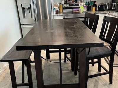 Brown dining table chairs and bench