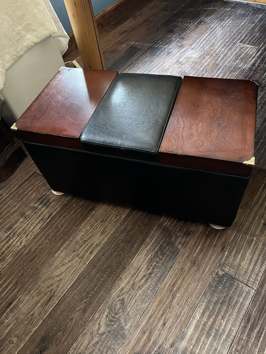 Black and Wood Storage Ottoman Bench with elevating Top for table use. We just used it in place of a linen closet.