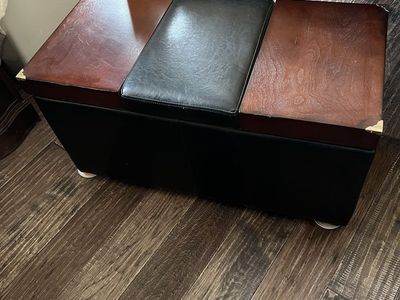 Black and Wood Storage Ottoman Bench with elevating Top for table use. We just used it in place of a linen closet.