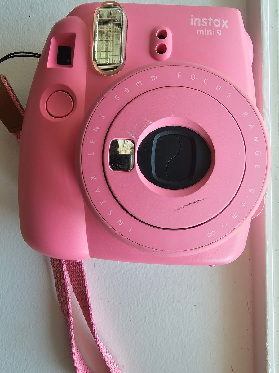Pink Fuji film camera with film