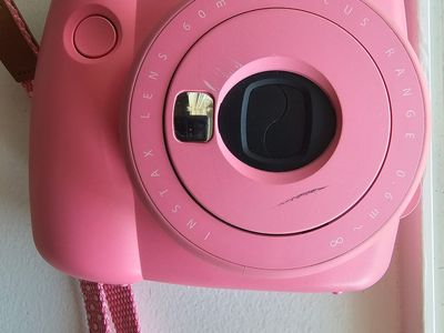 Pink Fuji film camera with film