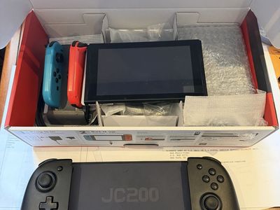 Nintendo Switch Console with Joy-Cons and JC200 Controller - Original Box Included with a extra large controller and charger