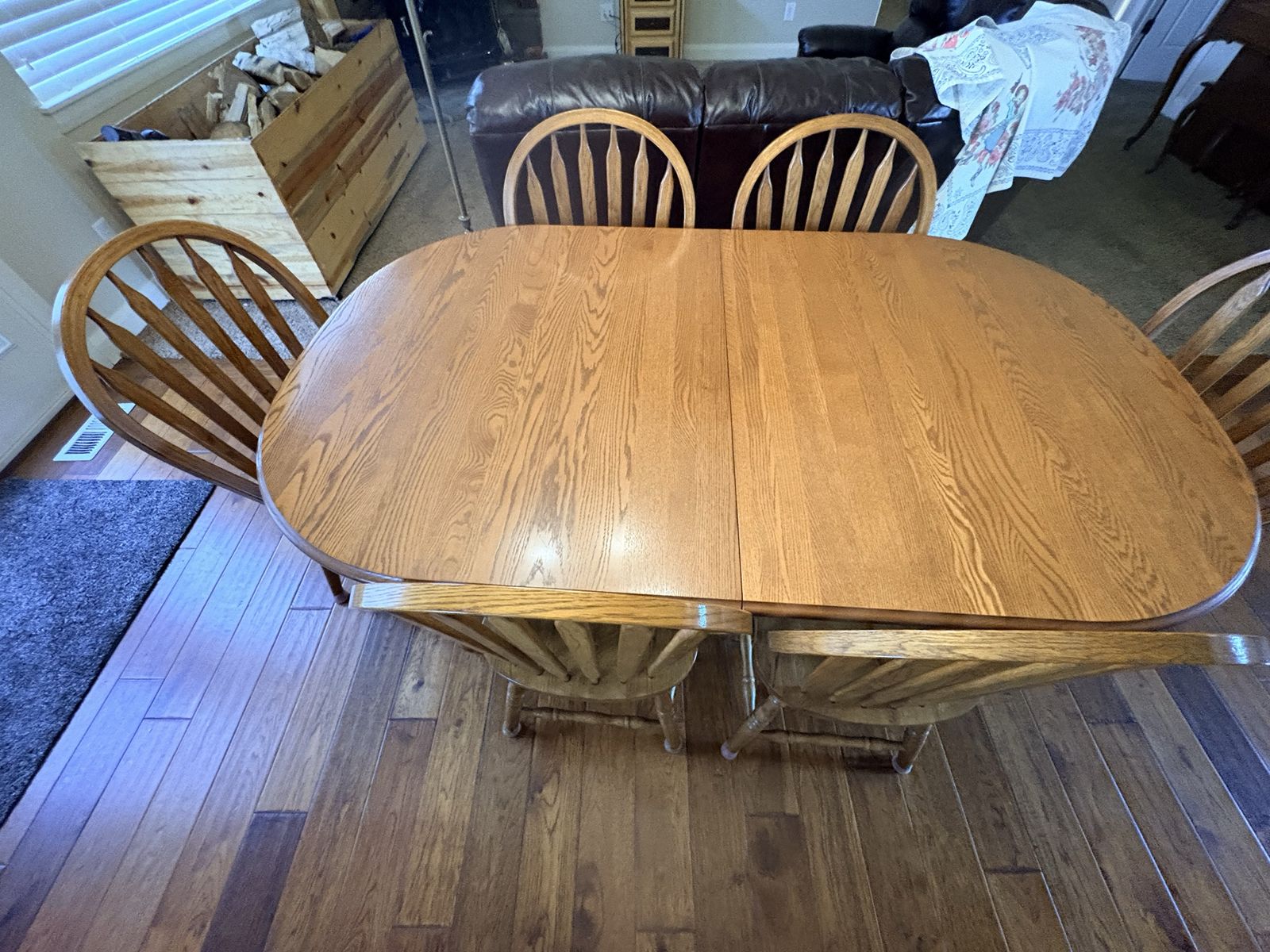 Richardson hand made solid oak dinner table will seat 12 extra leafs store inside table with 6 chairs table is like new wife 