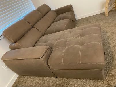 Convertible sectional sleeper couch W/ hidden storage.