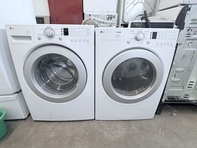 LG White Front Load Washer & DLE2516W 7.3 cu. ft. White Electric Dryer
