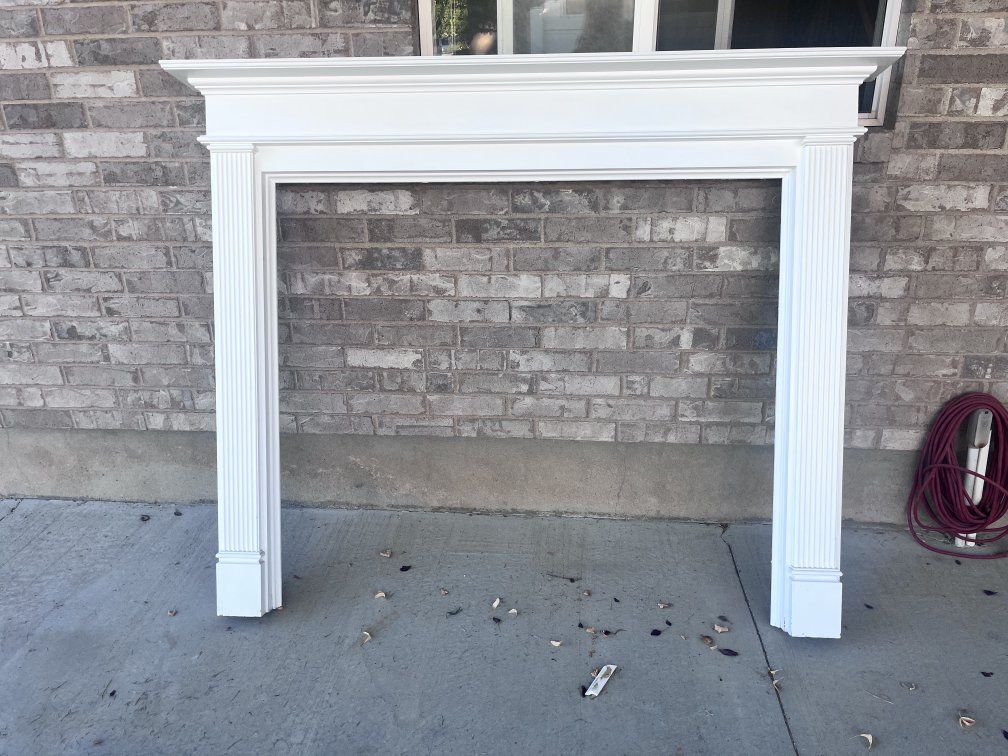 White painted fireplace mantel