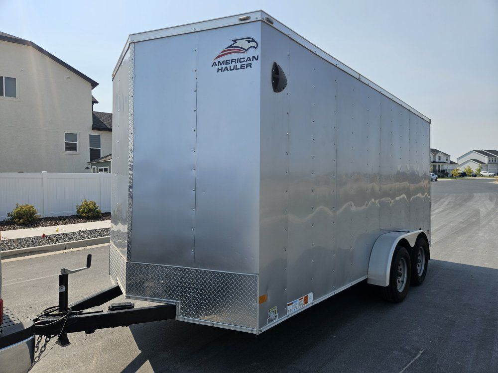like new conditions 2024 American Hauler Tandem Axle Enclosed Cargo Trailer with Side Door and Rear Ramp 7x16 + v nose