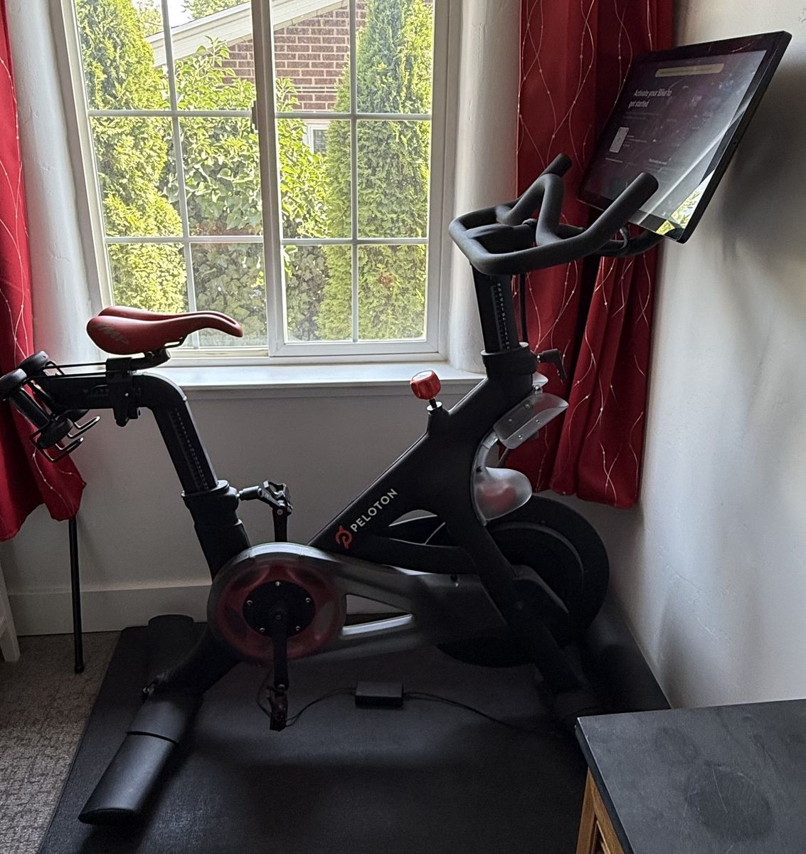Peloton Bike with Upgraded SMP Comfort Saddle, Shoes, Mat & Weights