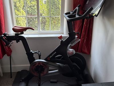 Peloton Bike with Upgraded SMP Comfort Saddle, Shoes, Mat & Weights