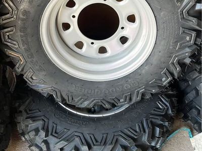 25X10-12 NEW PAIR OF ROAD GUIDER TIRES W/WHEELS