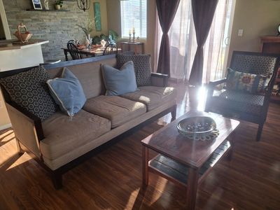 Couch with throw pillows and with matching chair