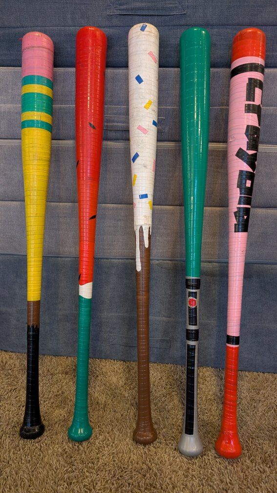 Baseball Wiffleball bats, hand taped by my son.