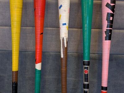 Baseball Wiffleball bats, hand taped by my son.