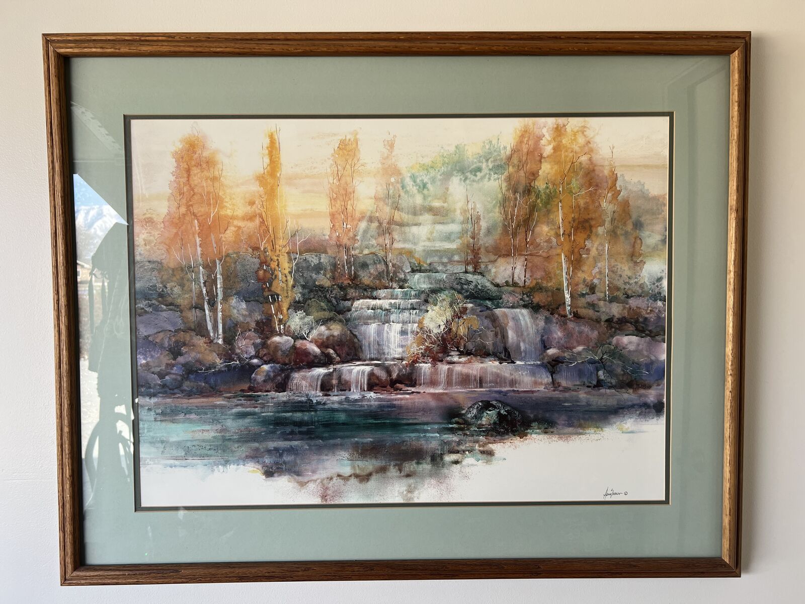 Watercolor print of a Waterfall Over Rocks by Adin Shade with frame measures 38 1/2 x 30 1/2.