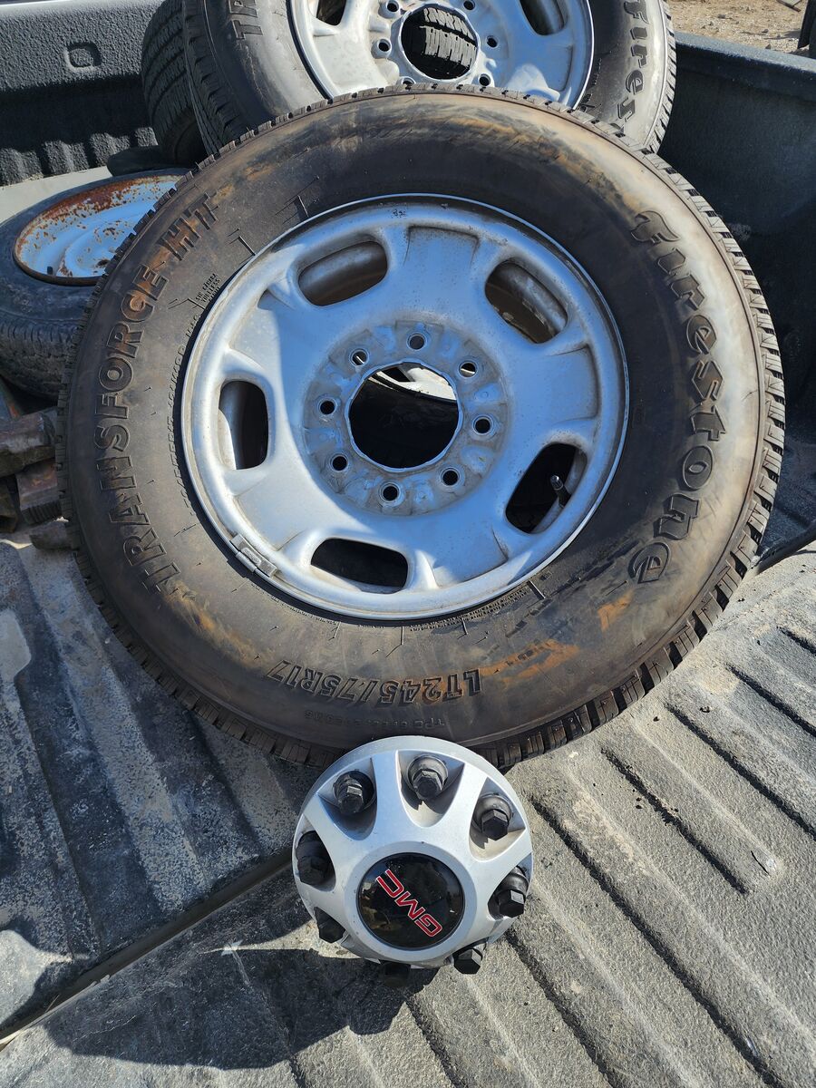 Four tires and rims off of factory 2023 GMC 2500.