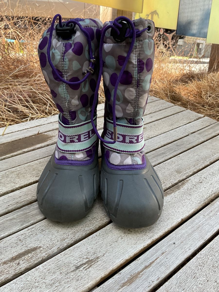 purple snowboots with purple, teal, and white polkadots