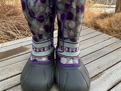 purple snowboots with purple, teal, and white polkadots