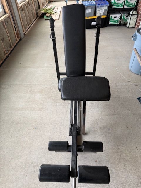 Incline bench with leg extension and preacher curl attachments