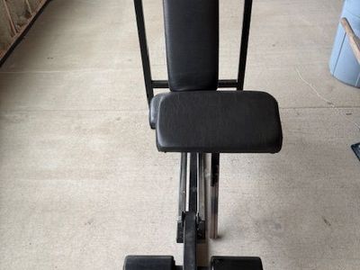 Incline bench with leg extension and preacher curl attachments