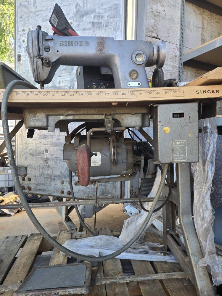 Singer industrial sewing machine on table