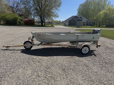 Boat, trolling motor, trailer