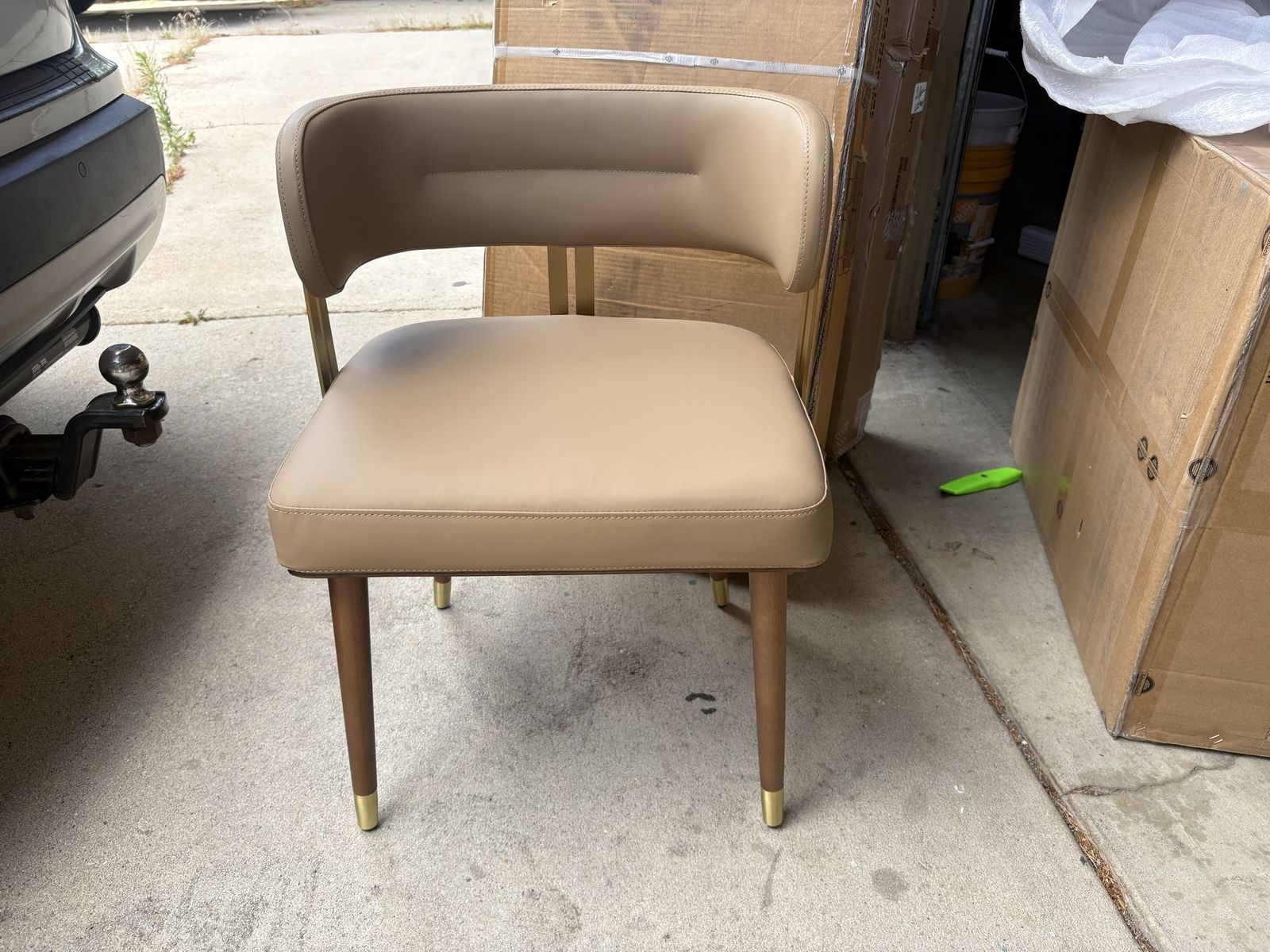 Modern Tan Faux Leather Dining Chair with Wood Back and Brass Accents