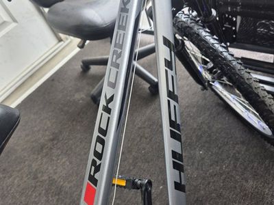 Upgraded Huffy Rock Creek 24" - Near New & Fully Loaded!
This silver Huffy Rock Creek 24-inch mountain bike is in truly perfect