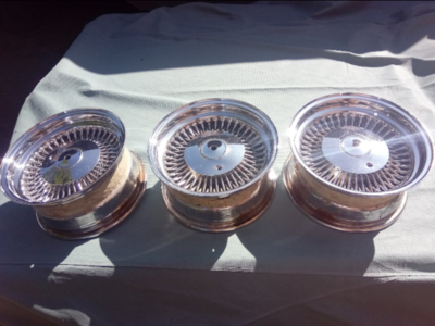 3 matching 14x7 bolt on lowrider wire wheels and caps