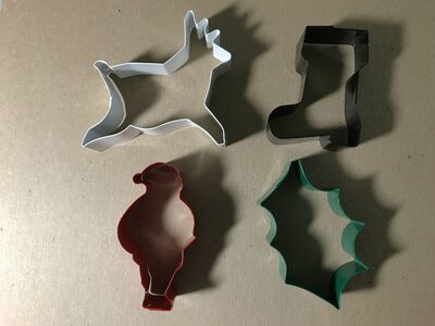 Wilton 4 Enamel Painted Cookie Cutters Santa, Deer, Boot and Holly Leaf
