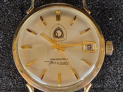 I’m selling a used vintage HAMILTON auto wind wristwatch in a yellow gold-filled case