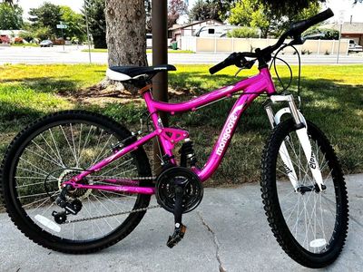 Mongoose Ledge 2.1 24” Girls Mountain Bike – 21 Speed, Full Suspension Description