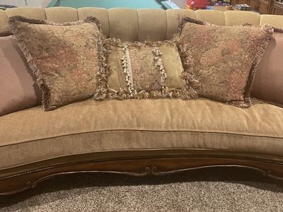 Vintage Curved Tufted Fabric Sofa with Carved Wood Trim and Matching Pillows
