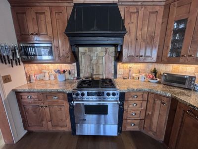 Granite counter, Copper Sink, Jennair dishwasher and kitchenaid sink Plus all cabinets