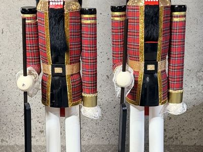 This Festive Pair of 5-Ft Tall Plaid Nutcracker Soldiers will delight both adults & children alike!
