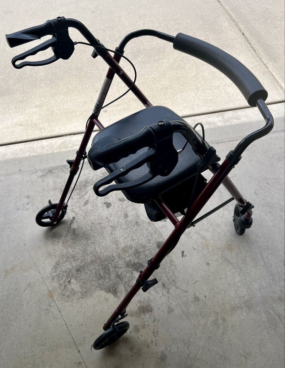 Red Rolling Walker with Seat and Hand Brakes