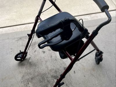 Red Rolling Walker with Seat and Hand Brakes