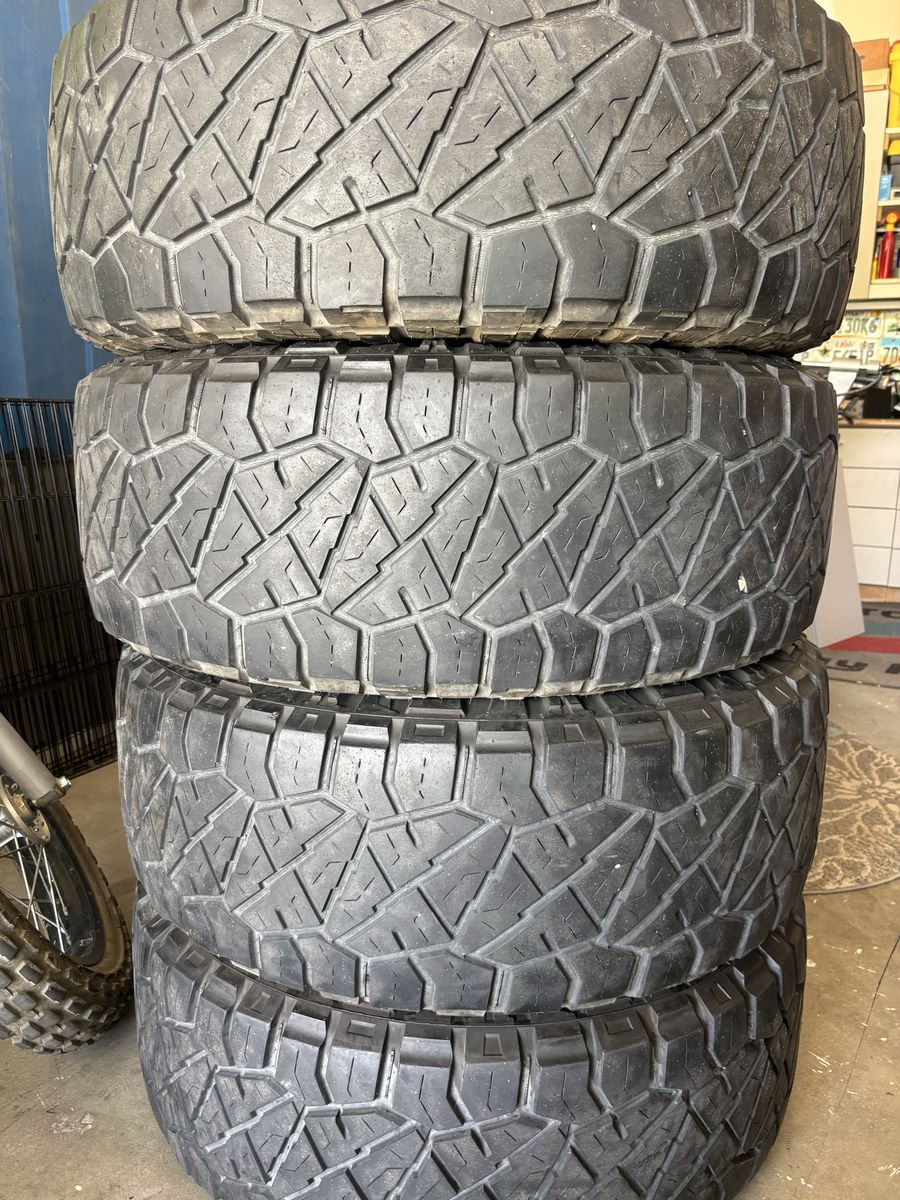 Nitto Ridge Grappler 37x12.50R20LT Tires with Black Rhino Wheels