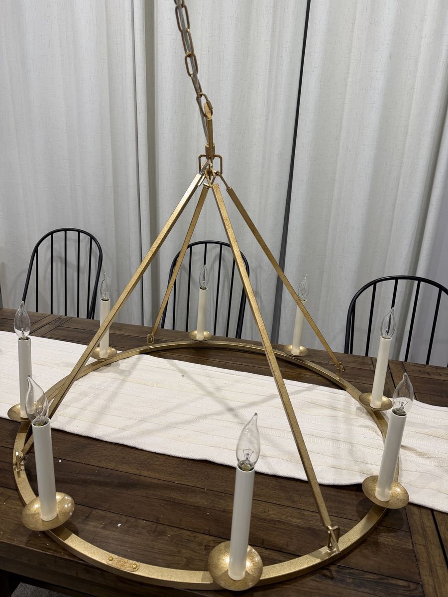 LOVEDIMA 35.4-inch 8-light gold wagon wheel chandelier with an antique brass finish.