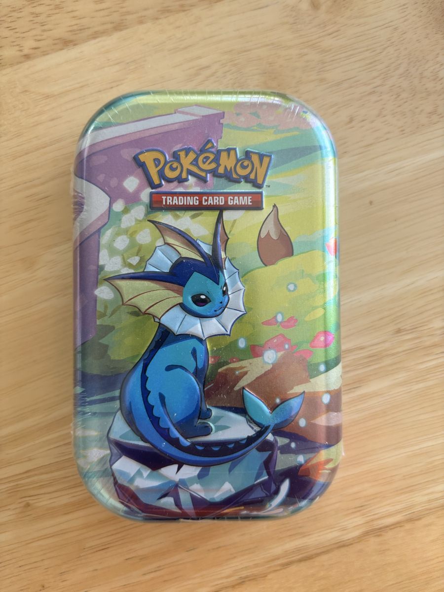 Pokemon prismatic evolutions sealed mini tin