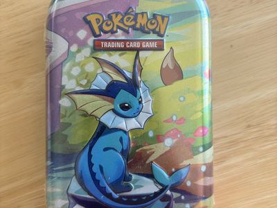 Pokemon prismatic evolutions sealed mini tin