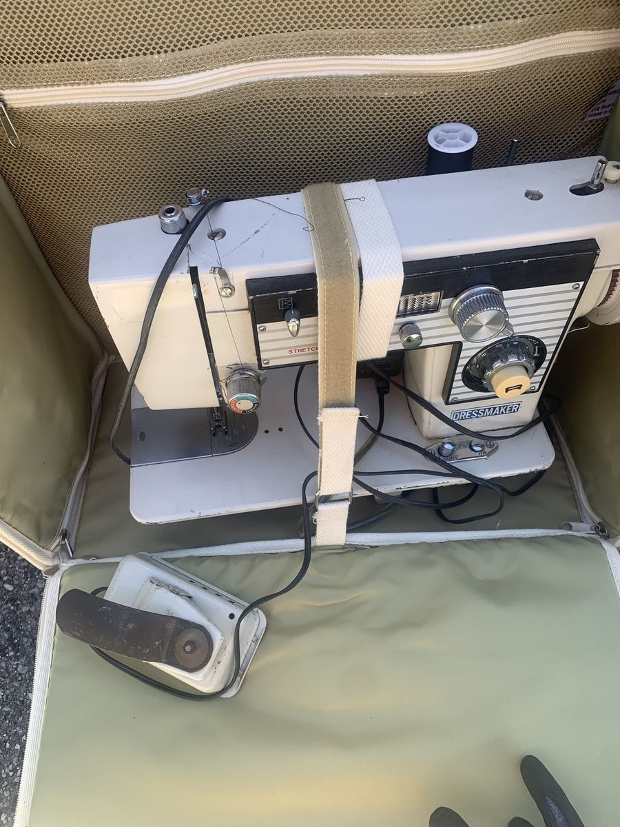 Vintage dressmaker stretch stitch sewing machine with rolling tote carrier