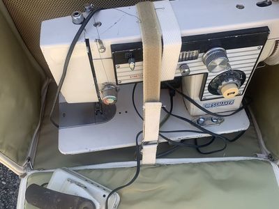 Vintage dressmaker stretch stitch sewing machine with rolling tote carrier