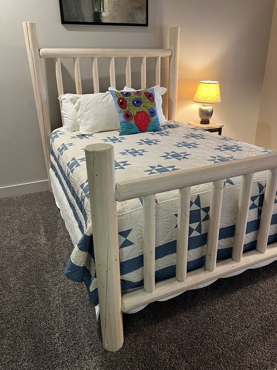 Queen log bed frame