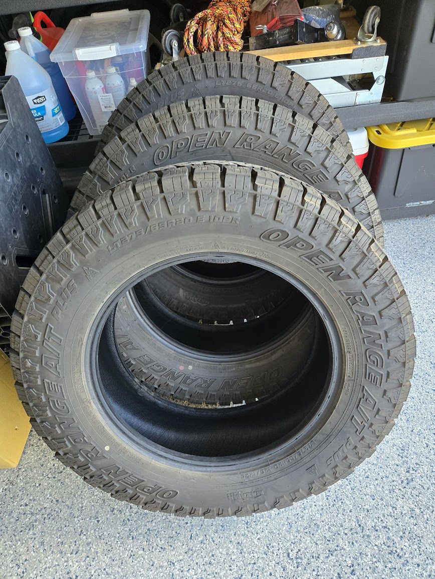 Three LT275/65R-20/10 Open Range AT Plus Tires