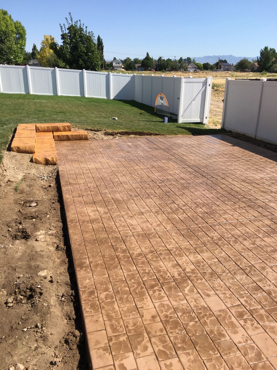 Stock Construction | Concrete Work | Stamped Concrete | RV Pads | Stone Retaining Walls | Hot Tub Pads